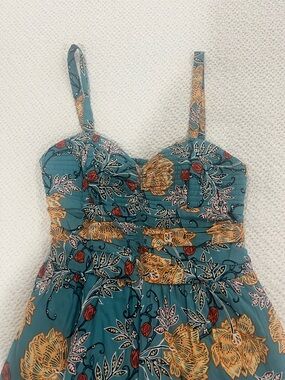 Teal Floral Jumpsuit with yellow and red accents